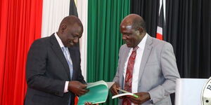 President William Ruto (left) interacts with former IEBC Chairperson Wafula Chebukati during a meeting held at State House on January 17, 2023. 