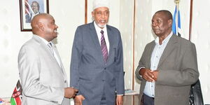 Principal Secretary in the Ministry of Public Service Amos Gathecha (left) , Kenya Association of Retired Officers (KARO) Chairperson, Mr. Ahmed Hussein Ahmed and a member of the association during a meeting on January 19, 2023. 