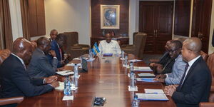 President Uhuru Kenyatta (centre) holds a roundtable meeting with represetatives of the DRC government and rebel groups on January 31, 2023. 