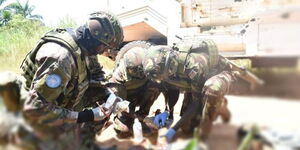Kenya Defence Forces officers perform first aid on an injured civillian in the DRC. 