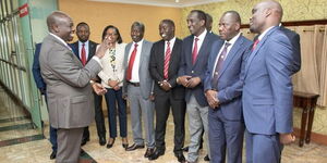 Deputy President Rigathi Gachagua (left) chats with governors from the Rift Valley region after a meeting at the Harambee Annex on February 2, 2023. 