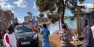 Police lob tear gas canisters after a rally in Kiambu turned rowdy on March 17, 2023. 