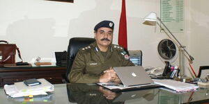 Muhammad Athar Waheed seated in his office in Pakistan. 