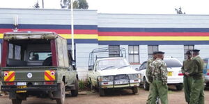 An image of vehicles parked outside a police station