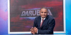 Veteran News anchor Badi Muhsin seated in the revamped KBC studio