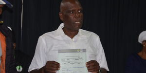 Voi MP-elect Khamisi Chome displays his certificate at the Voi constituency tallying centre in Mwangea Secondary School on Thursday 11 August 2022