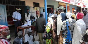 An image of elderly Kenyans in a queue to get services.