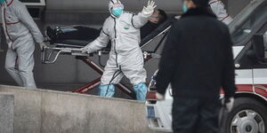 Medical workers move patients to a hospital in Wuhan, China on January 17, 2020.