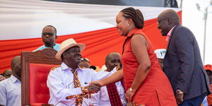 Kirinyaga Governor Anne Waiguru (right) greets ODM leader Raila Odinga (left) at a past BBI meeting in early January 2020