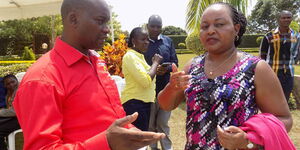 Kirinyaga Governor Anne Waiguru (right) speaks to her deputy Peter Ndambiri.