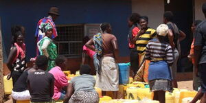 File photo of residents lining up to get water