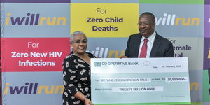 Co-operative Bank Group Managing Director & CEO, Dr. Gideon Muriuki hands a Ksh20 million cheque to First Lady Margaret Kenyatta at State House on Wednesday, February 19, 2020.