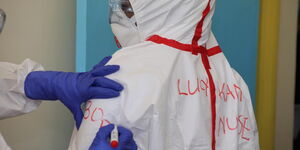 A medical practitioner has her name written on the protective gear at a Coronavirus isolation and treatment facility in Mbagathi District Hospital on Friday, March 6, 2020.