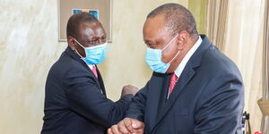 President Uhuru Kenyatta shares a light moment with DP William Ruto at State House on June 1, 2020.