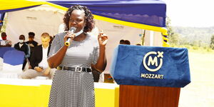 St Basil Lurambi Primary School Deputy Headteacher Mabel Afandi speaking after the launch of the water project