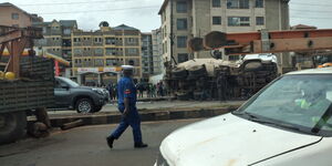 File image with a traffic police officer on Friday, February 11 2021at the scene where the truck overturned