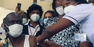 Health Acting Director General Dr Patrick Amoth receives the Covid-19 vaccine on Friday, March 5