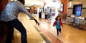 Westgate hero Abdul Haji saving a little girl during the terror attack in 2013.