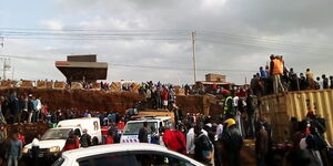 Crowd gathers in Kangemi after a flyover under construction collapses.