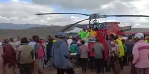Ngong residents move around DP Ruto's chopper in Kimuka, Kajiado West on December 3, 2021. 