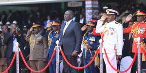 President William Ruto (second from right) standing in respect to the National Anthem together with Military officers at Kasarani Stadium on September 13, 2022