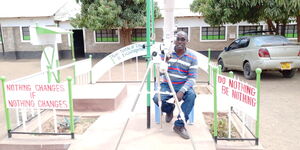 George Mwangi, a teacher at St. Georges Cornerstone Secondary School, poses for a photo.