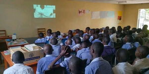 Class 7 & 8 pupils from Mirogi Boarding School following Babu Owino's online mathematics class