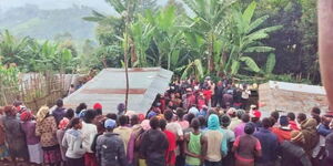 Witnesses at a house in Kapcheplim Village, Elgeyo Marakwet County where bodies of a mother and three children were found on Saturda, July 25, 2020.