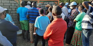 Witnesses outside the couple's house in Machakos on Sunday, July 12, 2020.