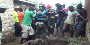 A woman in pit latrine 