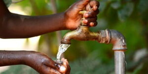 Undated file image of woman washing hands from a water tap.