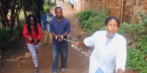 Two women drag an alleged thief in Ngong, Kajiado County on April 18, 2020