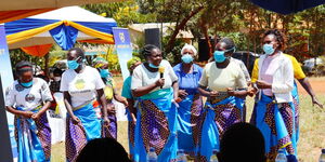 Women entertain guests during the roll out of a water project by Mozzart Bet