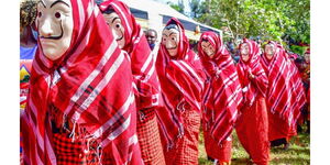 Women wear masks during a past ruracio ceremony