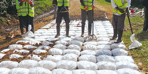 Workers construct a road using the Do-Nou technology in Uganda