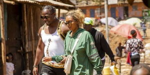 Yema Khalif and his wife Hawi Awash taking a stroll in Kibra slums in May 2021..jpg