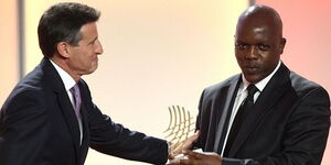  World Athletics President Sebastian Coe (left) awarding Nation Media Group Sports journalist Elias Makori (right) in 2012