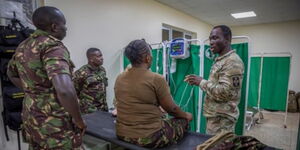 U.S. Army Reserve Spc. Israel Osagie, 425th Medical Detachment,176th Medical Brigade, 807th Medical Command, practical nursing specialist, demonstrate the electrocardiogram machine with the doctors and nurses of the Kenyan Defence Forces in Nanyuki, Kenya on Feb, 29, 2024.