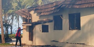 A Kenya Red Cross firefighter at the scene where fire broke out