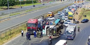 A bus full of energy drinks overturns along Mombasa Road.