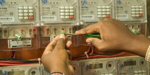 A man fixing an electricity meter 