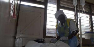 A nurse attends to a cholera patient at a hospital in Kisumu in 2018 