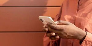 A person using a mobile phone