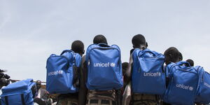 A photo of children carrying backpacks from UNICEF