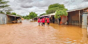 A photo of employees from Red Cross assisting in areas affected by heavy rains in Kenya in 2023