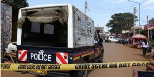 A photo of police officers at a past crime scene