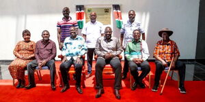 A photo of Siaya Deputy Governor William Osuol (standing in white shirt) joins President William Ruto and other leaders in Siaya County during the commissioning of  the JOOUST Blue Economy Research Hub in Siaya County on January 14, 2023.