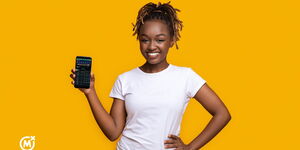A stock image of a girl holding a phone