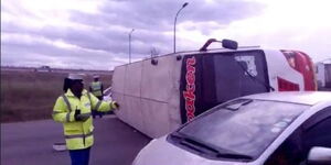 A passenger bus overturns at Mombasa Road near JKIA on Sunday, June 11, 2023.