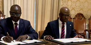 Gandy Thomas, the acting representative of Haiti to the United States and the Kenyan ambassador to the US, Lazarus Amayo signing deployment agreement on June 21, 2024